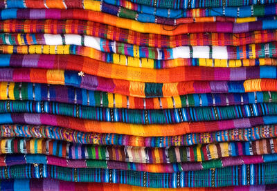 Stack of colorful fabrics.