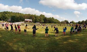 Large circle of children playing outdoor