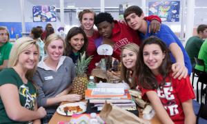 Mix It Up participants pose at a table