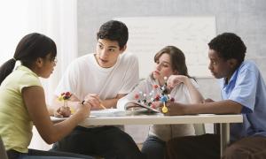 Teens work together on a science problem.