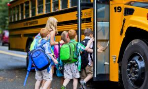 children boarding school bus