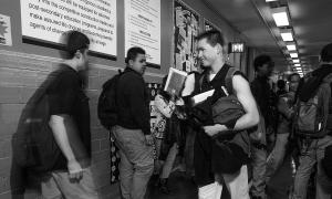 Teaching Tolerance photo of High School hall with Students passing by