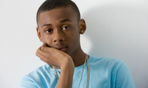 teenage male posing pensively