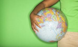 boy holding globe