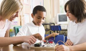 students doing electricity project in class