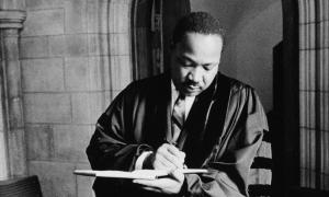 MLK writing in pastoral robe