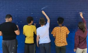 Students painting wall | TT Grants Spotlight