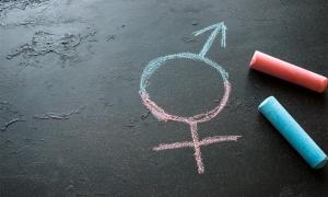 Fused male and female symbol drawn with chalk on a blackboard.