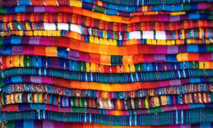 Stack of colorful fabrics.