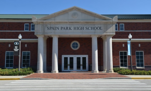 The front facade of Spain Park High School during the day.