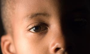 Close up of young African-American child.