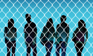 Silhouettes of children behind a chainlink fence.