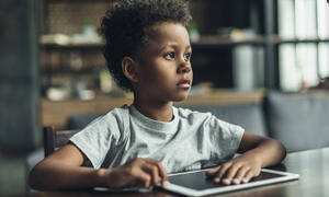 Young student with a digital tablet.