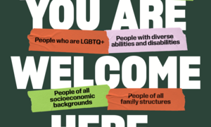 Poster with the words "You Are Welcome Here." displayed.