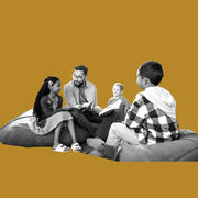 Adult and group of children talking