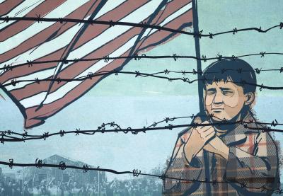 Child holding US flag behind barbwire