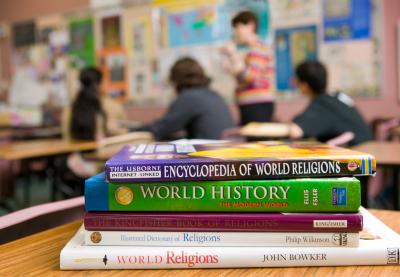 Stock of books about religion inside a classroomi