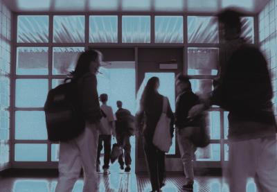 Out of focus photo of students walking on school halls