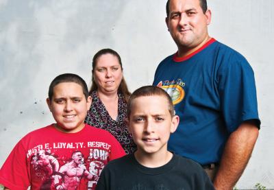 Irma Lucena and Carmelo Vega, with their sons, Mike Vega and Alex Vega.