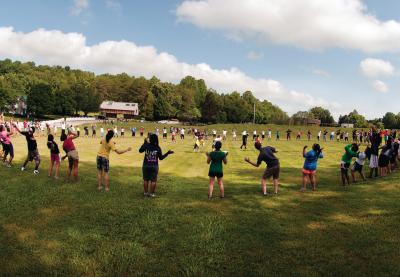 Large circle of children playing outdoor