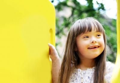 girl on yellow playground equipment