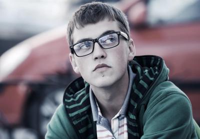 teenage boy with glasses and chin piercing
