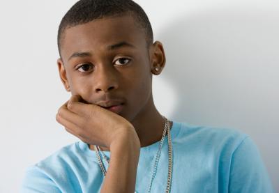 teenage male posing pensively