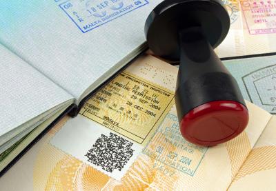 immigration papers and stamp