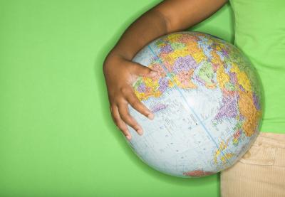 boy holding globe