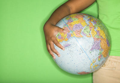 student holding a globe