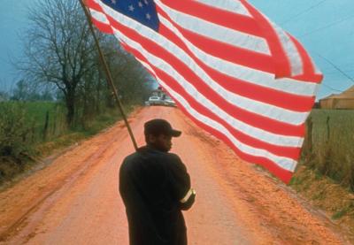 Man carrying the American flag