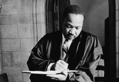 MLK writing in pastoral robe