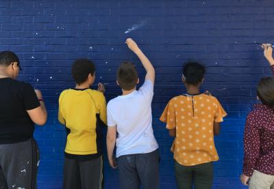 Students painting wall | TT Grants Spotlight