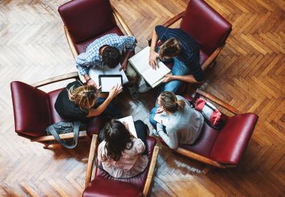 Group of teachers in discussion and seated in a circle