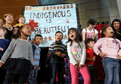 Group of young students putting on a performance on Indigenous Peoples Day.