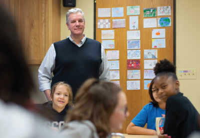 Chris Dolgos looking over his class of students.