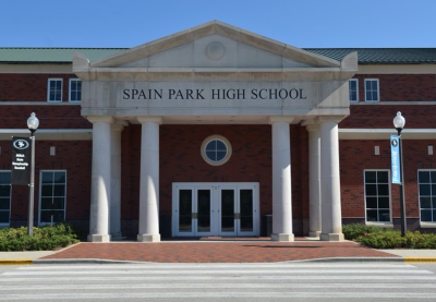 The front facade of Spain Park High School during the day.