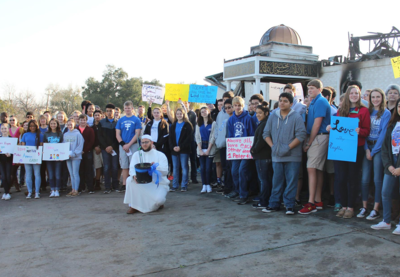 Students of St. Joseph High School gathered in front of burned Mosque in solidarity.