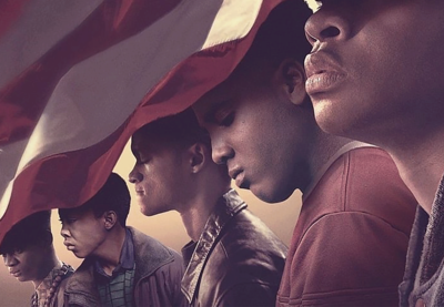 Cover image of the Netflix limited series 'When They See Us,' featuring five young men of color who are partially covered by the American flag.