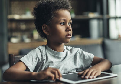 Young student with a digital tablet.