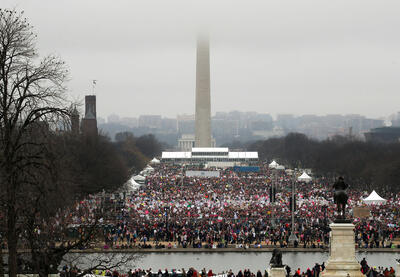 A photo of thousands of people in front of the Washington Monument during the 2017 Women's March