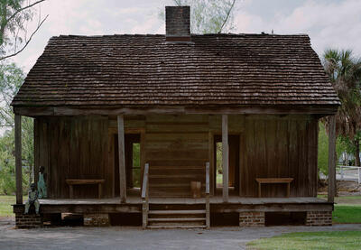 Photograph of an old cabin.