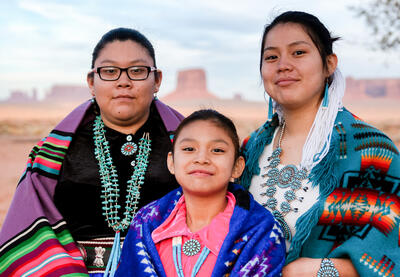 Three Native Americans in traditional dress