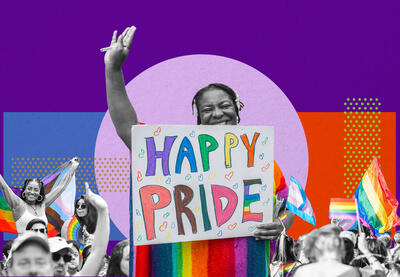 Pride Celebration with woman holding sign that reads Happy Pride