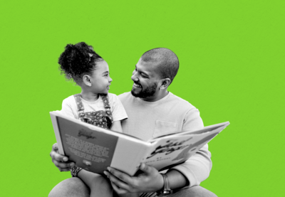 Black father and daughter reading
