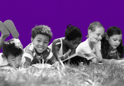 diverse children reading outside