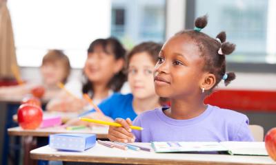 female student listening in class