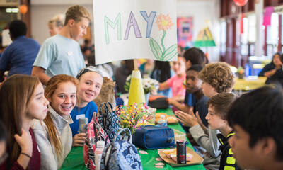 Students with May birthdays sitting together at lunch
