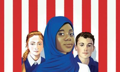 Three kids in front of the U.S. flag.