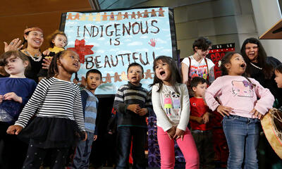 Group of young students putting on a performance on Indigenous Peoples Day.